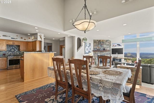 dining space with light wood-type flooring