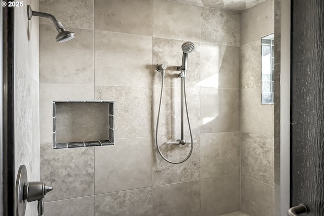 bathroom featuring tiled shower