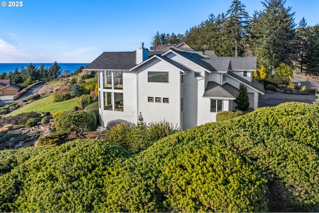 view of home's exterior featuring a water view