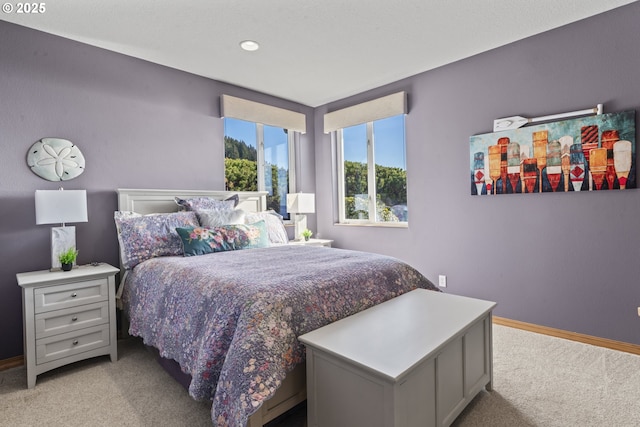 bedroom featuring light colored carpet