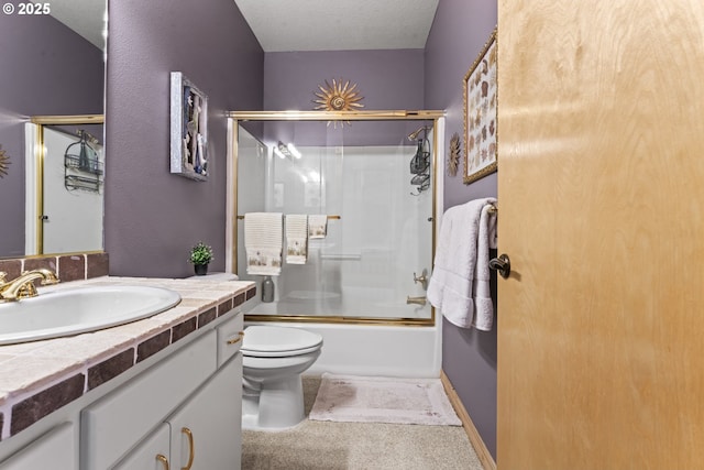 full bathroom featuring vanity, toilet, combined bath / shower with glass door, and a textured ceiling