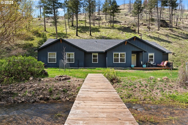 34336 Stices Gulch Rd, Baker City, OR 97814 - rear view of property with board and batten siding, a wooden deck, and a shingled roof
