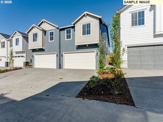 view of front facade featuring board and batten siding, a residential view, driveway, and an attached garage