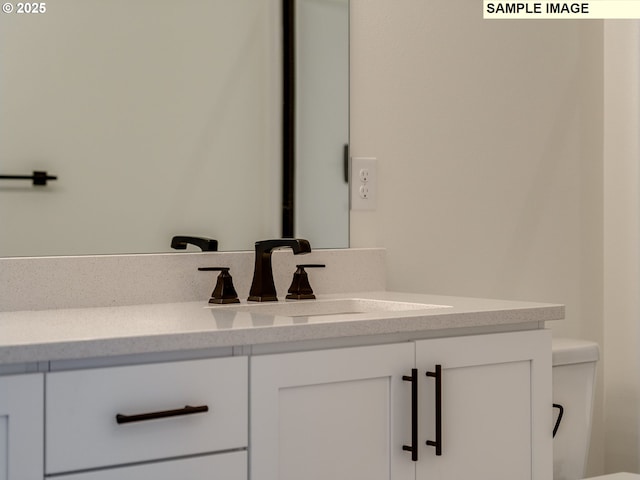 interior details featuring toilet and vanity