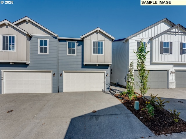 view of front of property with an attached garage, driveway, and board and batten siding