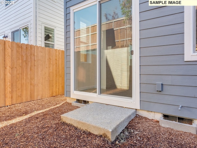 property entrance featuring fence