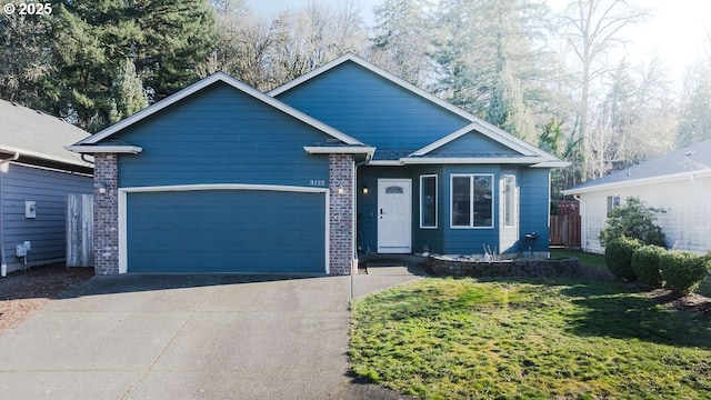 view of front of house featuring a garage and a front yard