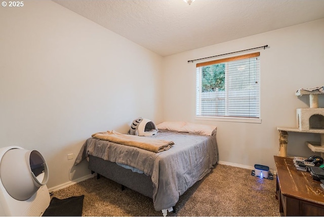 carpeted bedroom featuring a textured ceiling