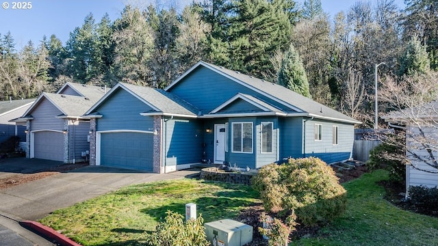 view of front of property with a garage and a front yard