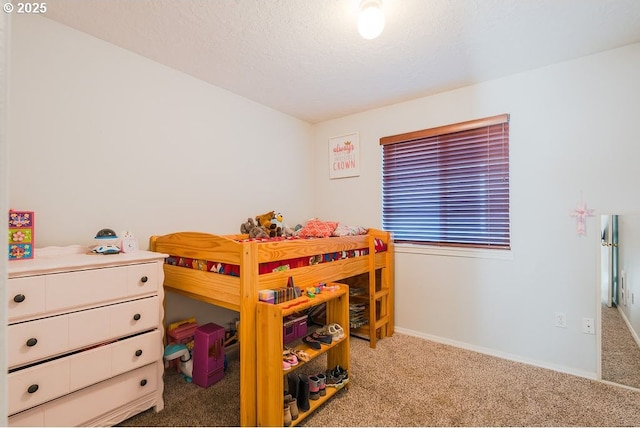 carpeted bedroom with a textured ceiling