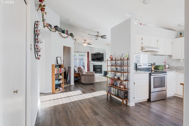 kitchen featuring white cabinetry, dark wood-type flooring, stainless steel range with electric cooktop, and ceiling fan