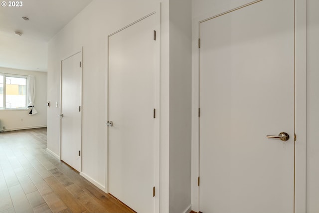 1125 NW 9th Ave Unit 512, Portland, OR 97209 - corridor with wood finished floors and baseboards