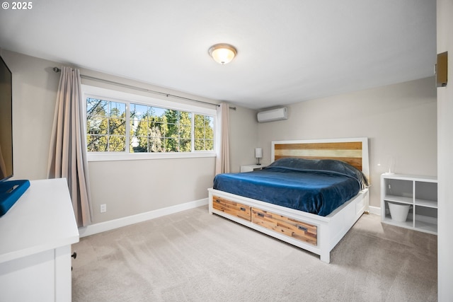 bedroom featuring a wall unit AC and carpet floors