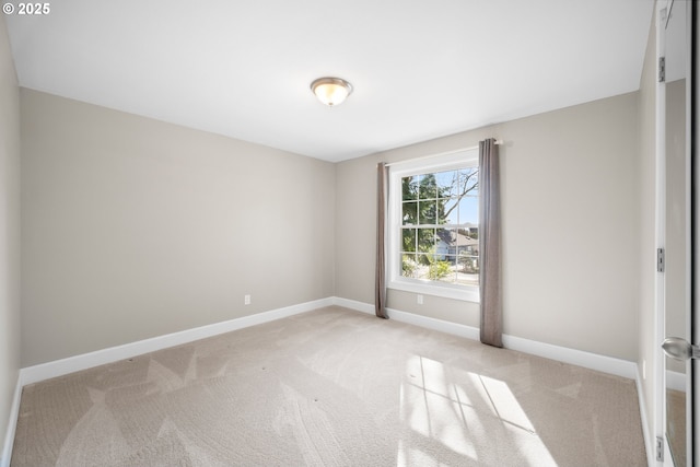 unfurnished room featuring light colored carpet