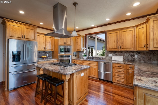 9684 Ankeny Crest Ln S, Salem, OR 97306 - kitchen featuring appliances with stainless steel finishes, island range hood, a kitchen island, dark wood finished floors, and crown molding