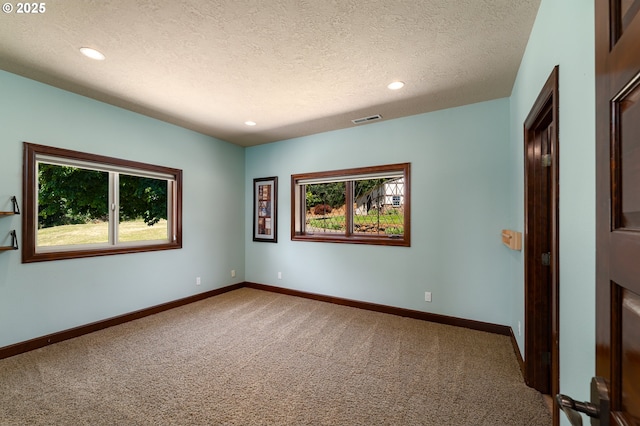 9684 Ankeny Crest Ln S, Salem, OR 97306 - carpeted empty room with a textured ceiling, baseboards, and recessed lighting