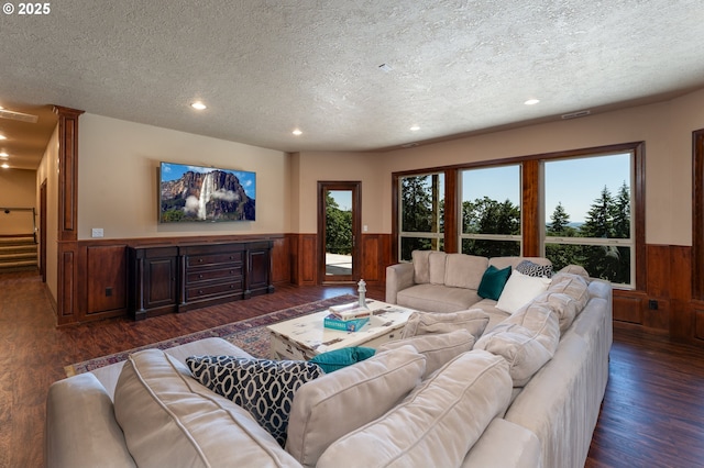 9684 Ankeny Crest Ln S, Salem, OR 97306 - living area featuring a textured ceiling, a wainscoted wall, dark wood-style floors, recessed lighting, and stairway