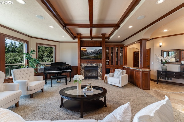 9684 Ankeny Crest Ln S, Salem, OR 97306 - living room featuring crown molding, ornate columns, recessed lighting, arched walkways, and beam ceiling