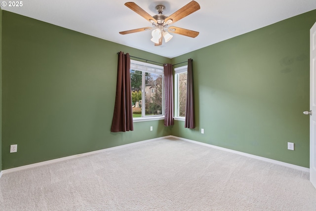 unfurnished room with baseboards, carpet floors, and ceiling fan