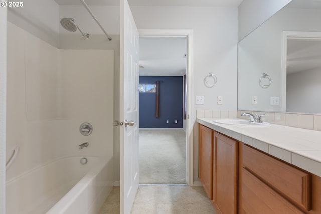 full bath featuring tub / shower combination, vanity, and tile patterned floors