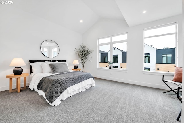 carpeted bedroom with vaulted ceiling