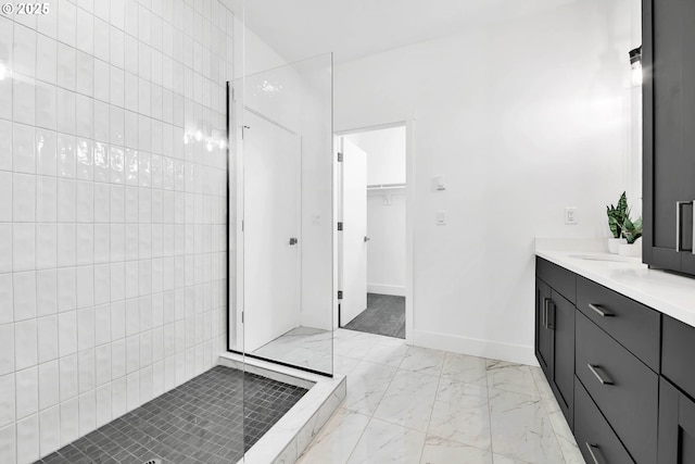 bathroom with vanity and a shower