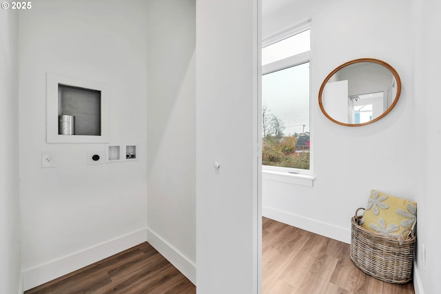 clothes washing area featuring washer hookup, electric dryer hookup, and hardwood / wood-style floors