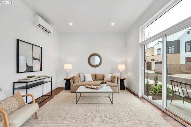 living room with wood-type flooring and a wall mounted air conditioner