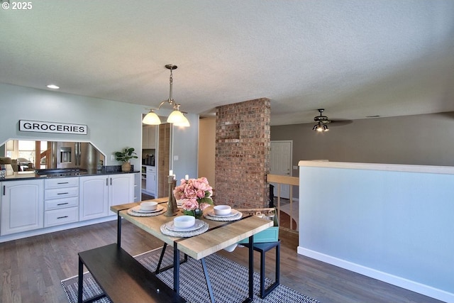 dining area with baseboards, a textured ceiling, dark wood finished floors, and ceiling fan