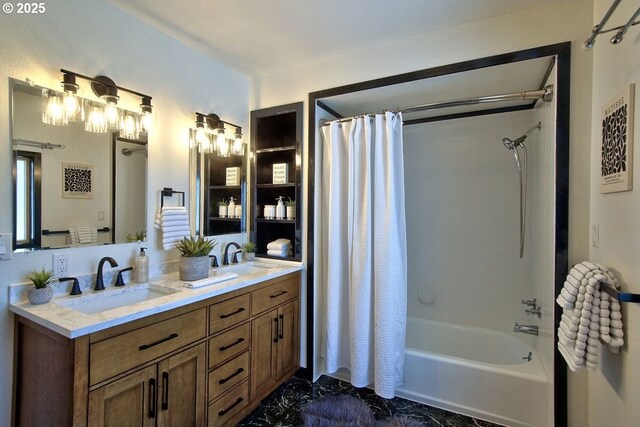 full bath with double vanity, a sink, marble finish floor, and shower / tub combo