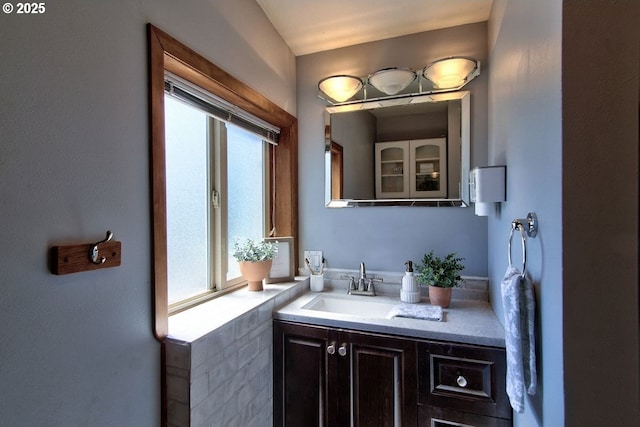 bathroom with vanity and a wealth of natural light