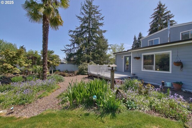 view of yard featuring a wooden deck