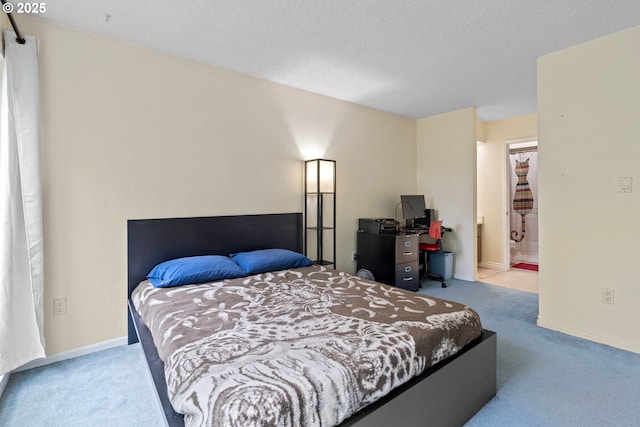 1659 NW Bridgeway Ln, Beaverton, OR 97006 - bedroom featuring carpet flooring, baseboards, connected bathroom, and a textured ceiling