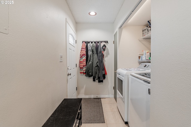 1659 NW Bridgeway Ln, Beaverton, OR 97006 - washroom with washer and clothes dryer, light tile patterned flooring, and recessed lighting