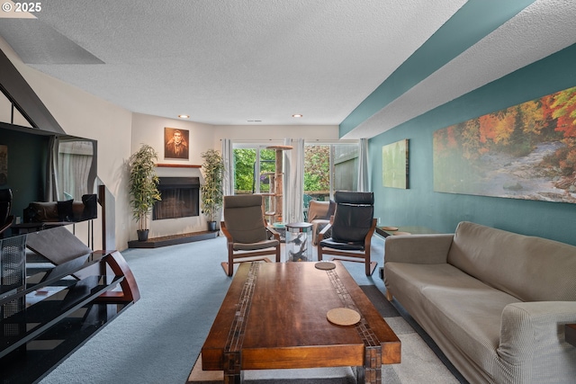 1659 NW Bridgeway Ln, Beaverton, OR 97006 - carpeted living area with a textured ceiling, a fireplace with raised hearth, and recessed lighting
