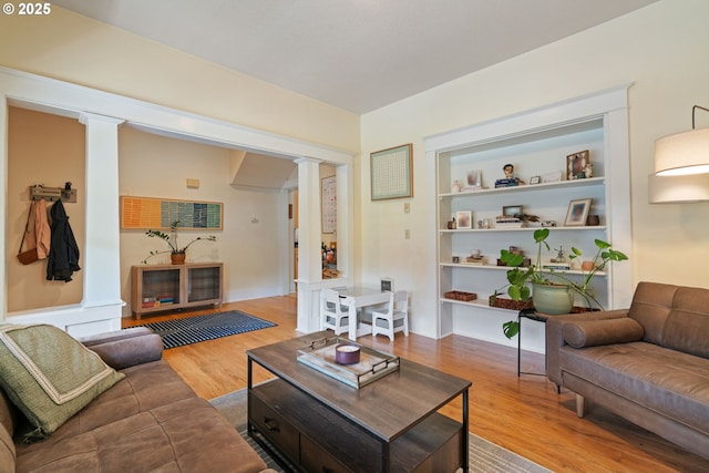 11151117 N Beech St, Portland, OR 97227 - living room featuring ornate columns and wood finished floors