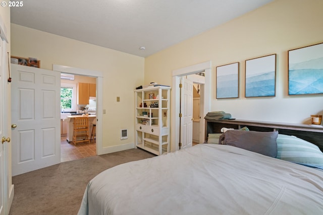 11151117 N Beech St, Portland, OR 97227 - bedroom featuring carpet flooring, an office area, heating unit, and ensuite bath