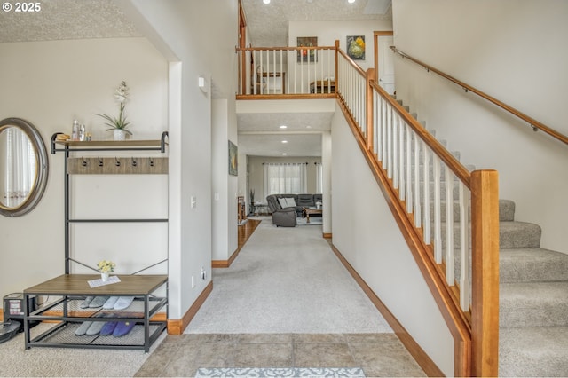 2459 SW Sandlewood Ln, Gresham, OR 97080 - staircase featuring carpet and a towering ceiling