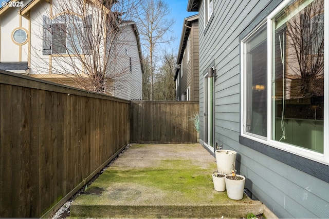 view of yard with a patio area and a fenced backyard