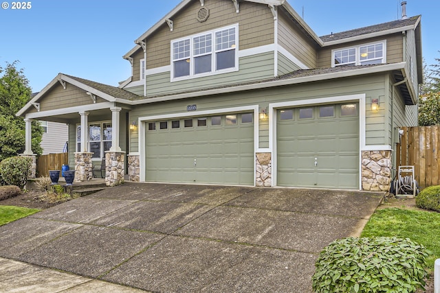 craftsman-style home with covered porch and a garage