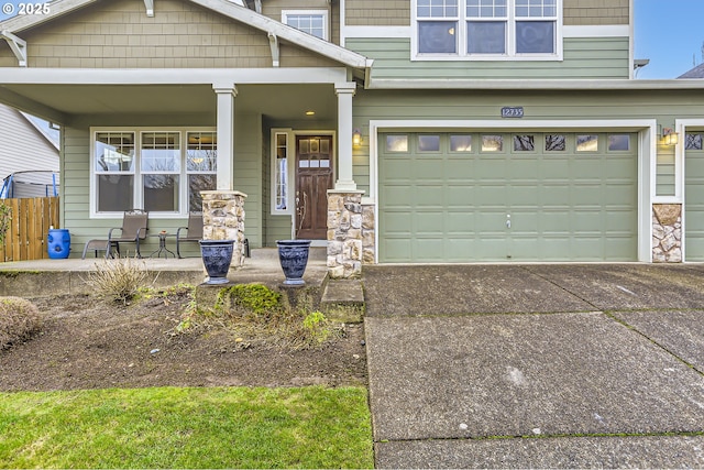 craftsman house featuring a porch and a garage