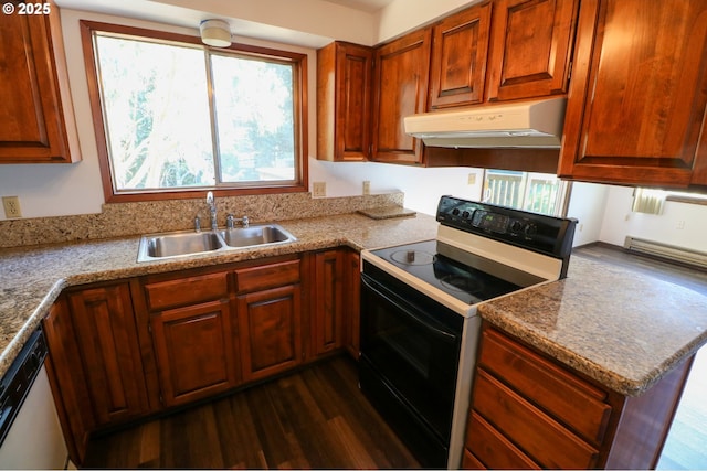 kitchen featuring dark wood-type flooring, stainless steel dishwasher, light stone countertops, black range with electric cooktop, and sink