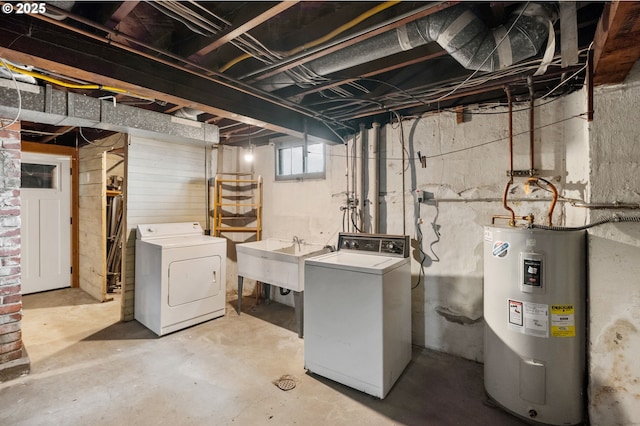 below grade area with washer and clothes dryer, water heater, and a sink