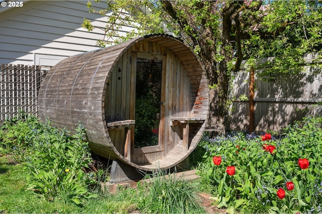 view of shed with fence