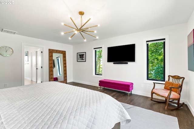 bedroom featuring visible vents, baseboards, a chandelier, and multiple windows