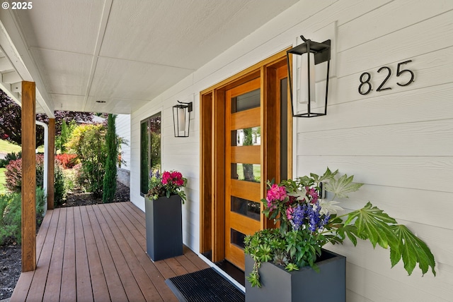 view of exterior entry with covered porch