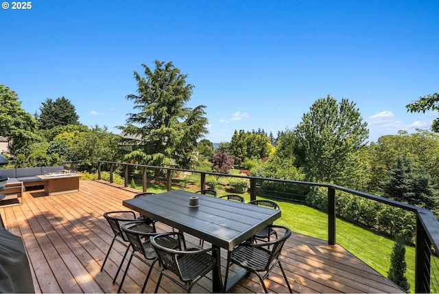 wooden deck with a lawn, outdoor lounge area, and outdoor dining space