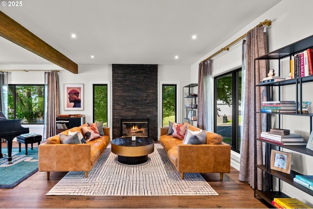 living room featuring recessed lighting, a fireplace, wood finished floors, and beam ceiling