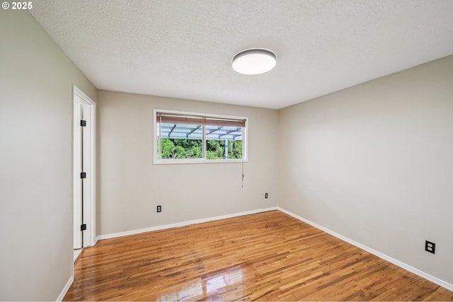 1631 N Clark St, Cornelius, OR 97113 - unfurnished room featuring light wood-style floors and a textured ceiling