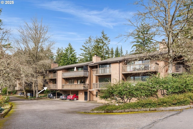 7538 SW Barnes Rd Unit H, Portland, OR 97225 - view of property featuring covered parking
